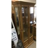 A modern, light wood display cabinet.Approx 97cmwx200hx40d