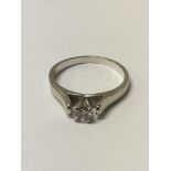 A 14ct white gold, diamond solitaire ring, square cut ring, stone approx .25ct. Size 0, 3.5 g