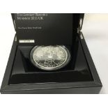 A five ounce silver proof coin , the longest reigning monarch 2015