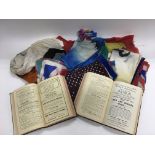 A collection of magician's silks and two volumes of Conjurer's Chronicle.