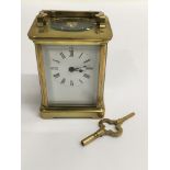 A Paris made, four glass brass carriage clock with key.