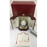 A limited edition, Sarah Faberge silver gilt and white enamel egg, with fitted ring holder interior,