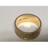 A Gents 18carat gold ring with a patterned edge. Weight 11g
