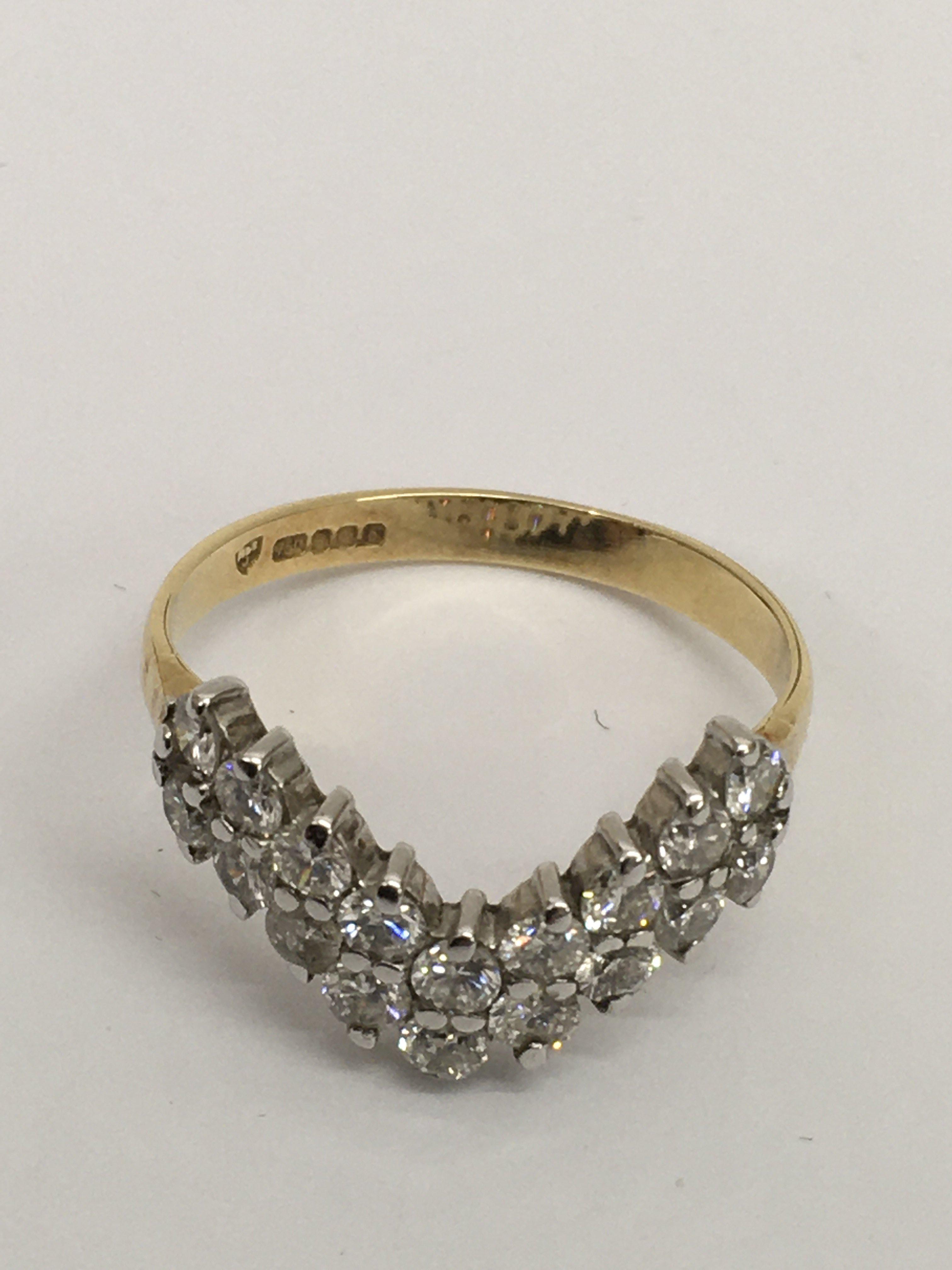 An 18ct gold, 'V' shape diamond cluster ring, cons