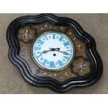 A Victorian wall clock with mother of Pearl inlaid