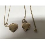 Two 9cart gold heart shaped lockets gold front and back with attached 9cart gold chains (2) total