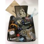 A tin containing costume jewellery and odds - NO R