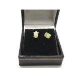 A pair of silver earrings set with Ethiopian white opals, boxed