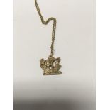 A 9ct gold pendant in the form of a gallon 8 grams approx with attached chain .