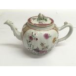 An 18th century Chinese export teapot, of lobed shape with floral painted reserves, matched lid.