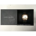 A boxed Marc Jacobs ladies watch with text around