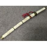 A similar 19th Century Japanese sword having brass fittings and carvings and 31cm blade