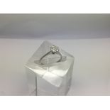 An 18ct white gold ring set with a solitaire diamo