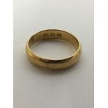 A 22ct gold wedding band.Approx 5.7g