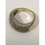 A 9k gold ring set with two rows of diamonds, approx .75.Size N, 7.3g