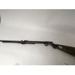 A Vintage BSA .22 under-leaver air gun with a mahogany stock blued steel action and barrel serial