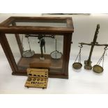 A set of beam balance scales in a fitted case plus a brass et of scales (2).