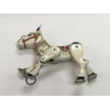 An articulated metal marionette of Muffin the Mule