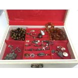 A jewellery box containing silver and amber jewellery and a Tiger's Eye necklace