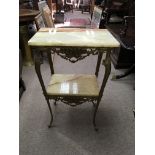 A gilt metal side table with two onyx tiers. Height approx 76cm.