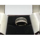 A 9ct gold ring set with black and white diamonds, approx 4.3g and approx size P.