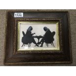 A brown framed silhouette of two Georgian style fi