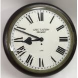 A Great Eastern Railway clock with Roman Numeral dial, key and pendulum, approx GER stamped on