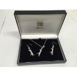 A white metal, cat pendant necklace and earring set