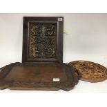 An Indonesian carved hardwood tray with a British military badge carved to the century and a