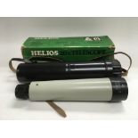 A boxed Helios 20x telescope.