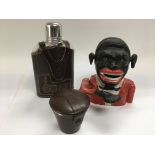 A reproduction novelty money bank, hip flask and stirrup cups.