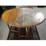 A drop leaf, barley twist table