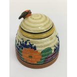 A Clarice Cliff 'Gayday' honey pot of ribbed form. Approx 10cm