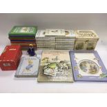 A collection of Beatrix Potter books, a Wind In The Willows pop up book and a boxed Royal Doulton