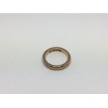 A 9ct gold wedding band, approx 4.6g and approx size L-M.
