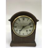 An Edwardian inlaid mantle clock by Carmerer, Cuss and Co.