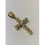 A gold and diamond set pendant cross set, approx 1ct. 9, 3g
