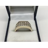A Gents 9ct gold signet ring with two rows of diam