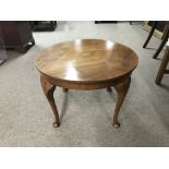 A small walnut occasional table. Diameter approx 60cm, height approx 42cm.