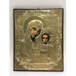 A silver icon with painted faces of Mary and Jesus, approx 21cm x 26cm.