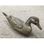 A small wooden decoy styled duck