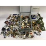 A collection of various badges including various reproduction police and military badges.