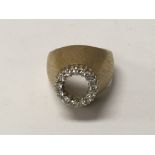 A unmarked contemporary ring inset with diamonds size M