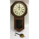 A USA Ansonia wall clock with pendulum and key