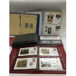 A box of first day covers and stamps.