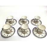 A fine quality, set of Worcester silver mounted coffee cans and saucers with painted floral