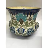 A Burmantofts jardiniere decorated with flowers and foliage in colours of blue a green 26 cm , and a