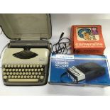 A typewriter, boxed Ferguson cassette recorder and