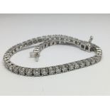 An 18ct white gold RBC diamond line bracelet, boxed. Diamonds 4.31ct