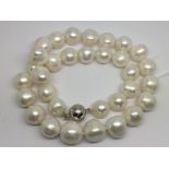 A string of cultured pearls with a 9ct white gold clasp